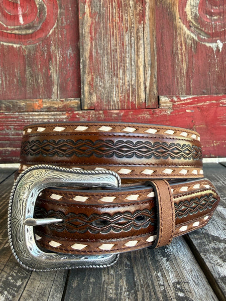 Chocolate leather with laced cutout edges, braided center tooling, and an engraved silver western buckle — a classic western belt with serious handcrafted detail. Find it at Blair's Western Wear in Marble Falls, TX or online at blairswesternwear.com.