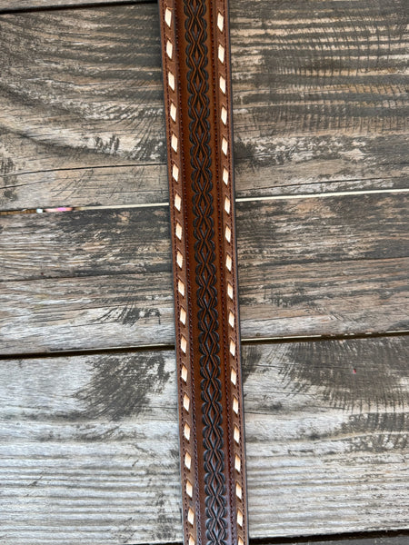 Chocolate leather with laced cutout edges, braided center tooling, and an engraved silver western buckle — a classic western belt with serious handcrafted detail. Find it at Blair's Western Wear in Marble Falls, TX or online at blairswesternwear.com.