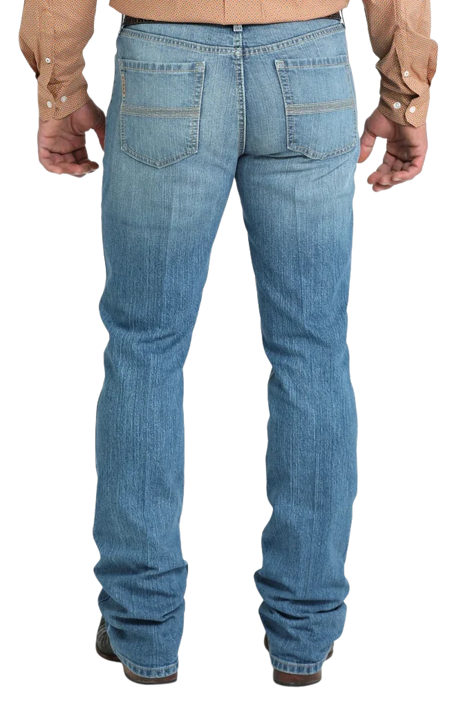 Men's slim fit stretch denim jean in medium stonewash with sanding and whisker details and boot-friendly leg opening — Blair's Western Wear Marble Falls TX