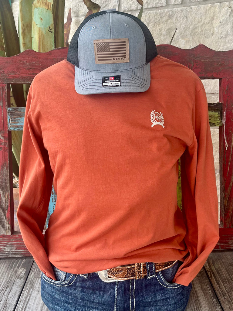 Men’s Cinch Long Sleeve Tee in Burnt Orange, soft breathable cotton-blend fabric for all-day comfort, with bold patriotic “Land of the Free” USA back print – MTK17210107. Available at Blair's Western Wear, Marble Falls, TX.