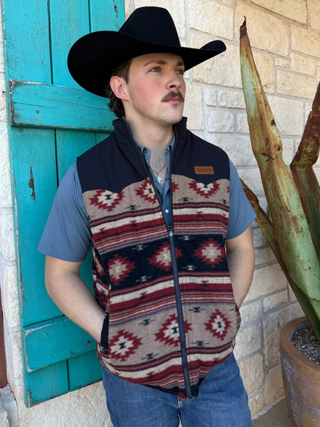 Men’s Cinch reversible western vest in navy and brown, features an Aztec fleece pattern and water-resistant tan quilted side, with lightweight insulation and dual hand pockets – MWV1576004. Available at Blair’s Western Wear, Marble Falls, TX.