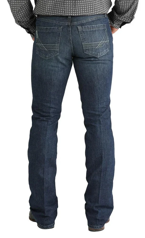 The Cinch Ian Slim Fit Jean features a mid-rise and a slim fit through the seat, thigh, and knee for a clean, modern look. Made with comfortable stretch denim and finished in a medium-dark stonewash, it offers classic five-pocket styling and a boot-friendly leg opening perfect for everyday wear. Men's Ian Slim Fit Jean - MB32036001 - BLAIR'S Western Wear 