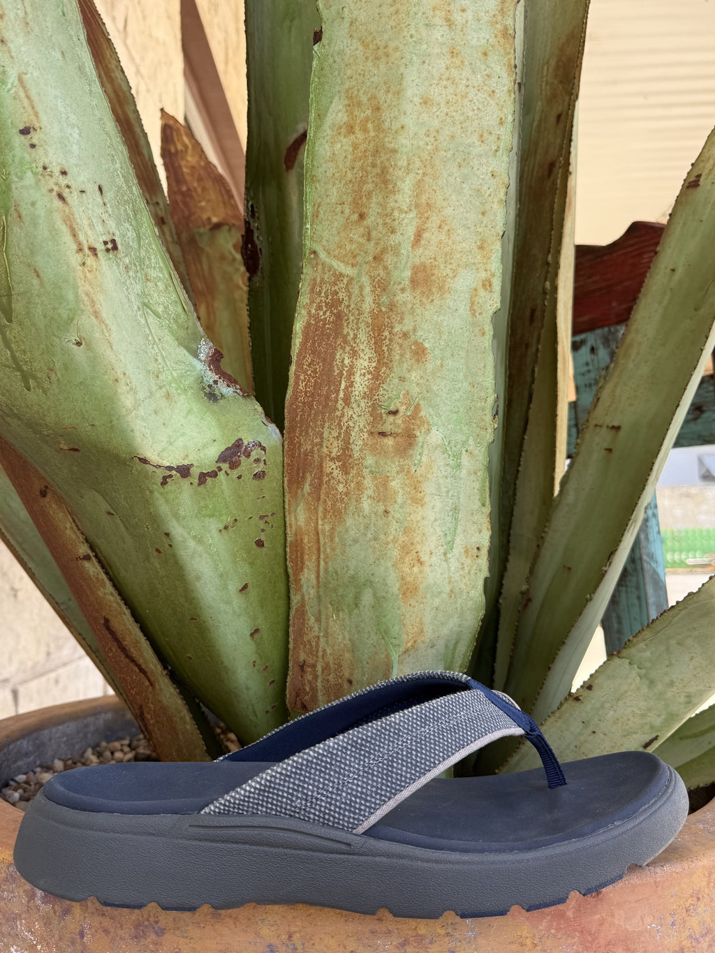 Men's navy canvas flip flop with wide strap, molded footbed, lightweight EVA outsole, and rubber traction inserts — Blair's Western Wear Marble Falls TX