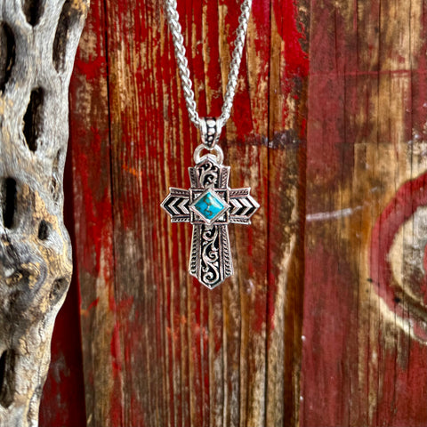 Men's Montana Silversmiths necklace silver cross with turquoise stone in silver, crafted in a detailed silver-tone cross design that delivers bold Western character, with intricate blackened scrollwork and geometric arrow-style detailing - NC6274. Available at Blair's Western Wear, Marble Falls, TX.