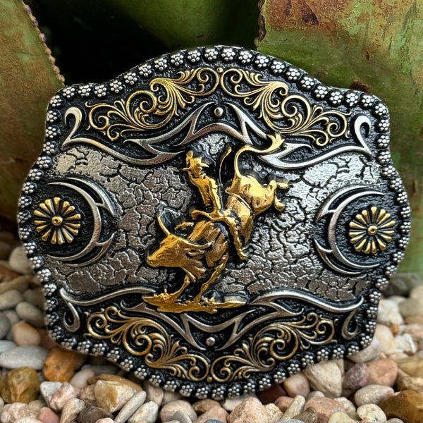 Men’s Montana Silversmiths Western Buckle Bull Rider in silver and gold, intricately detailed with rodeo-themed gold bull rider, with high-relief scrollwork and floral conchos - A886. Available at Blair's Western Wear, Marble Falls, TX.