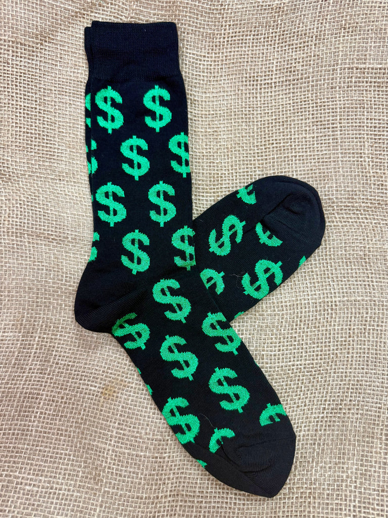 Men’s novelty socks with green dollar sign pattern in black, made from a soft cotton blend for comfort, with reinforced heel and toe for durability - MNC817. Available at Blair's Western Wear, Marble Falls, TX.