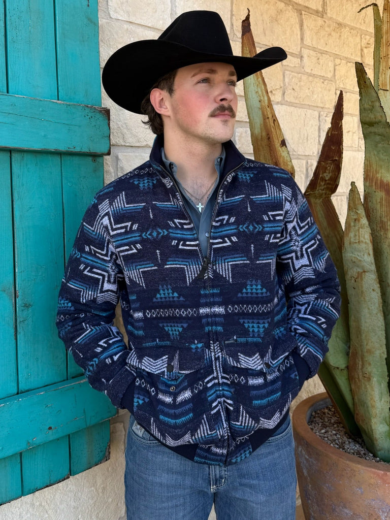 Men’s Panhandle Slim Aztec bomber jacket in navy blue, made from soft jacquard fabric with full-zip front, ribbed cuffs, and flap pockets – BM92C04333. Available at Blair’s Western Wear, Marble Falls, TX.