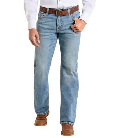 Men’s Panhandle Slim boot cut jean in medium wash, designed to fit over western boots without stacking, with durable double barrel construction for long-lasting wear – BM0SD06687. Available at Blair's Western Wear, Marble Falls, TX.
