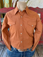 Men’s Panhandle Slim long sleeve solid Western shirt in rust, breathable woven cotton construction for all-day comfort, with snap front closure for easy wear – BMN2S07875. Available at Blair's Western Wear, Marble Falls, TX.