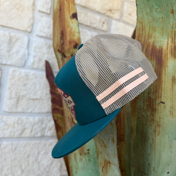 A teal and beige trucker cap with a flat brim,