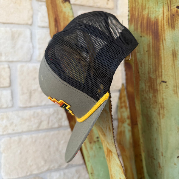 Red Dirt Hat Company Mesh Cap in Gray/Black/Yellow, with a bold Aztec-style logo patch on the front, and breathable black mesh backing for ventilation - RDHC267. Available at Blair's Western Wear, Marble Falls, TX.