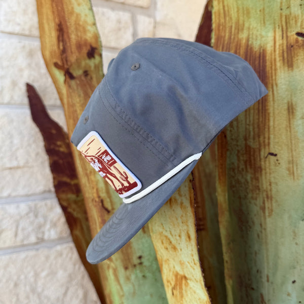 A gray cap with a white rope and a rectangular patch on the side,