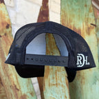 Black mesh trucker cap with a white embroidered 'RDH' logo on the side