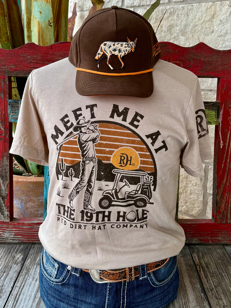 Men’s Red Dirt Hat Co. graphic tee short sleeve shirt in tan/brown, crafted from a soft breathable cotton blend, with a western-golf screen print built for long-lasting color – RDHCT174. Available at Blair's Western Wear, Marble Falls, TX.