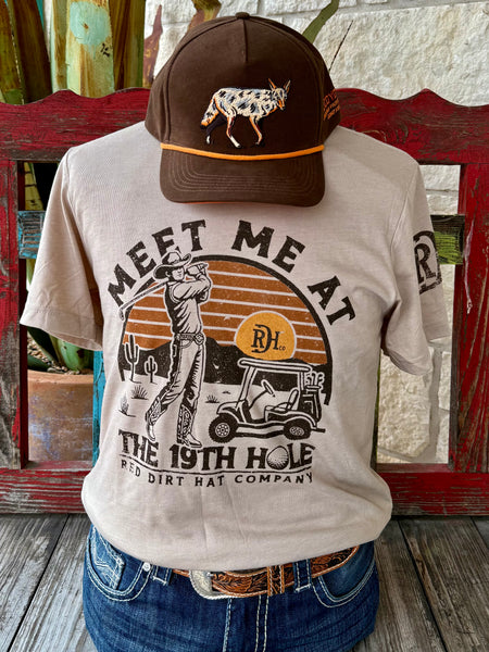 Men’s Red Dirt Hat Co. graphic tee short sleeve shirt in tan/brown, crafted from a soft breathable cotton blend, with a western-golf screen print built for long-lasting color – RDHCT174. Available at Blair's Western Wear, Marble Falls, TX.