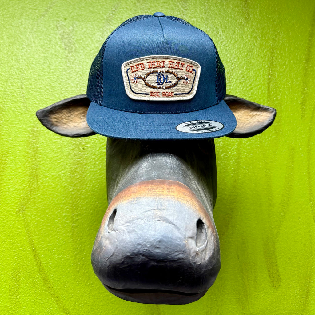 Men’s Red Dirt Hat Co. mesh snapback cap in navy, featuring breathable mesh panels and structured front with embroidered patch – RDHC584. Available at Blair's Western Wear, Marble Falls, TX.