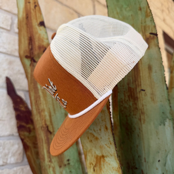 A brown and off-white trucker hat with a mesh back,