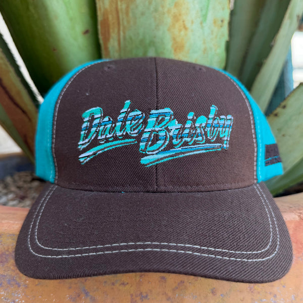 A brown and teal trucker hat with 'Dale Brisby' embroidered on the front,background.