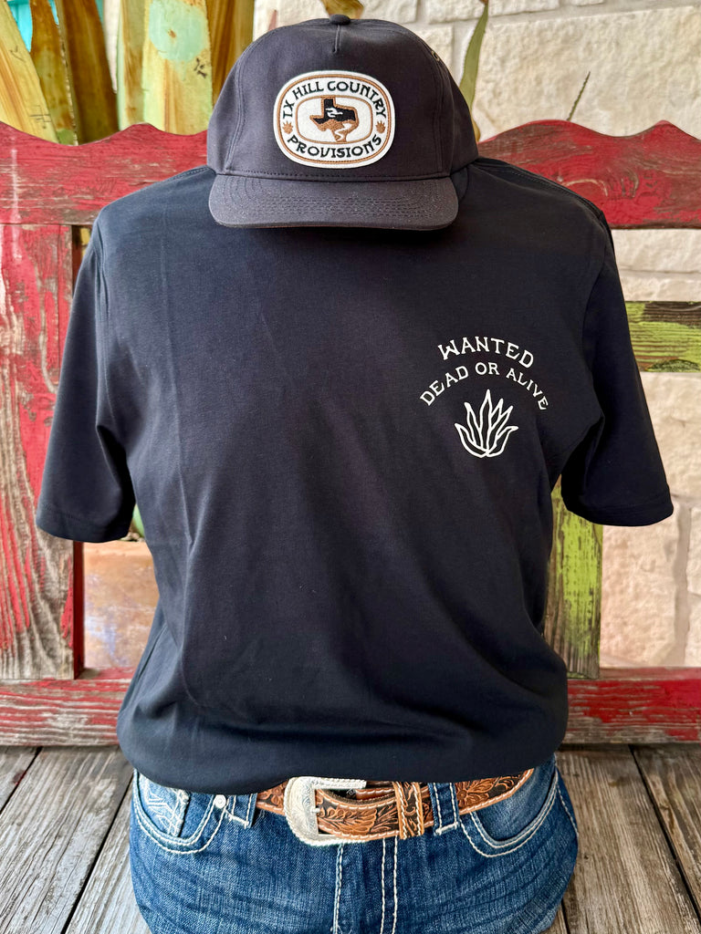Men’s Sendero short sleeve Wanted Cowboy T-shirt in black with “Wanted Dead or Alive” chest graphic, featuring bold skeleton cowboy artwork on the back, and made with a soft cotton blend for everyday comfort - DEAD OR ALIVE. Available at Blair's Western Wear, Marble Falls, TX.