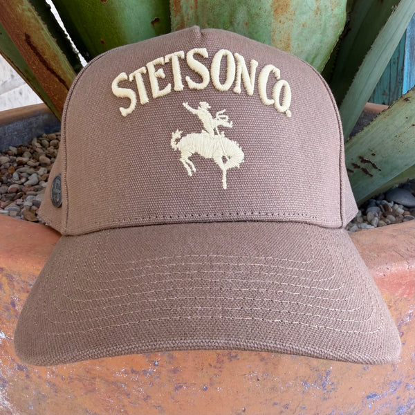 A brown Stetson Co. cap with cream embroidered lettering and logo