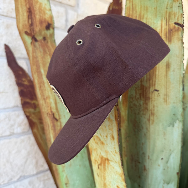A dark brown baseball cap with metal eyelets,
