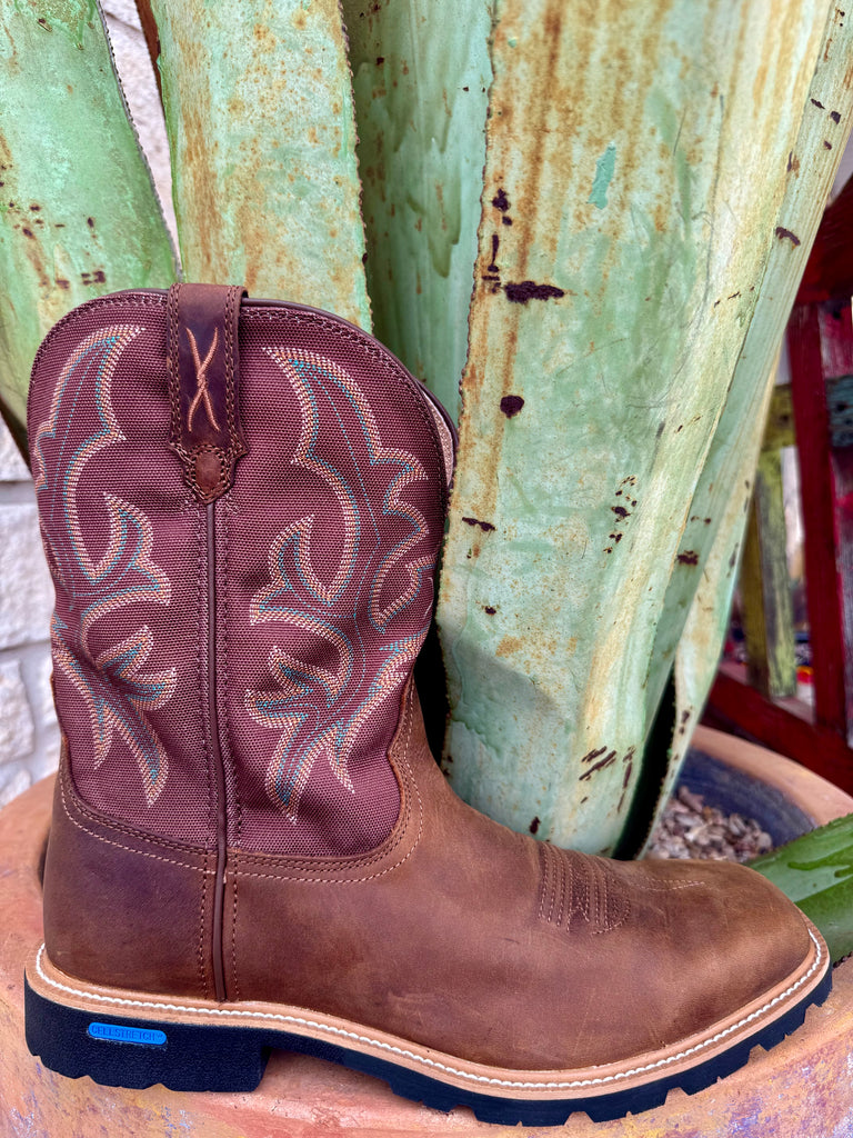 Men’s Twisted X work boot square toe in brown, full-grain leather vamp with breathable fabric shaft, featuring CellStretch® comfort technology and a slip-resistant rubber outsole – MXTP003. Available at Blair's Western Wear, Marble Falls, TX.