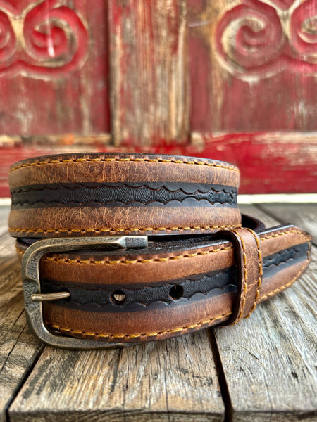 Men's Vintage Bison leather belt in honey and black, crafted from premium bison leather that offers exceptional durability while remaining flexible, with detailed scalloped edge tooling along the center strip - VB64063. Available at Blair's Western Wear, Marble Falls, TX.
