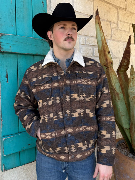 Men’s Wrangler Aztec Sherpa Jacket in brown, tan, and blue, featuring warm sherpa lining and durable jacquard shell with snap-front design – 112368213. Available at Blair’s Western Wear, Marble Falls, TX.
