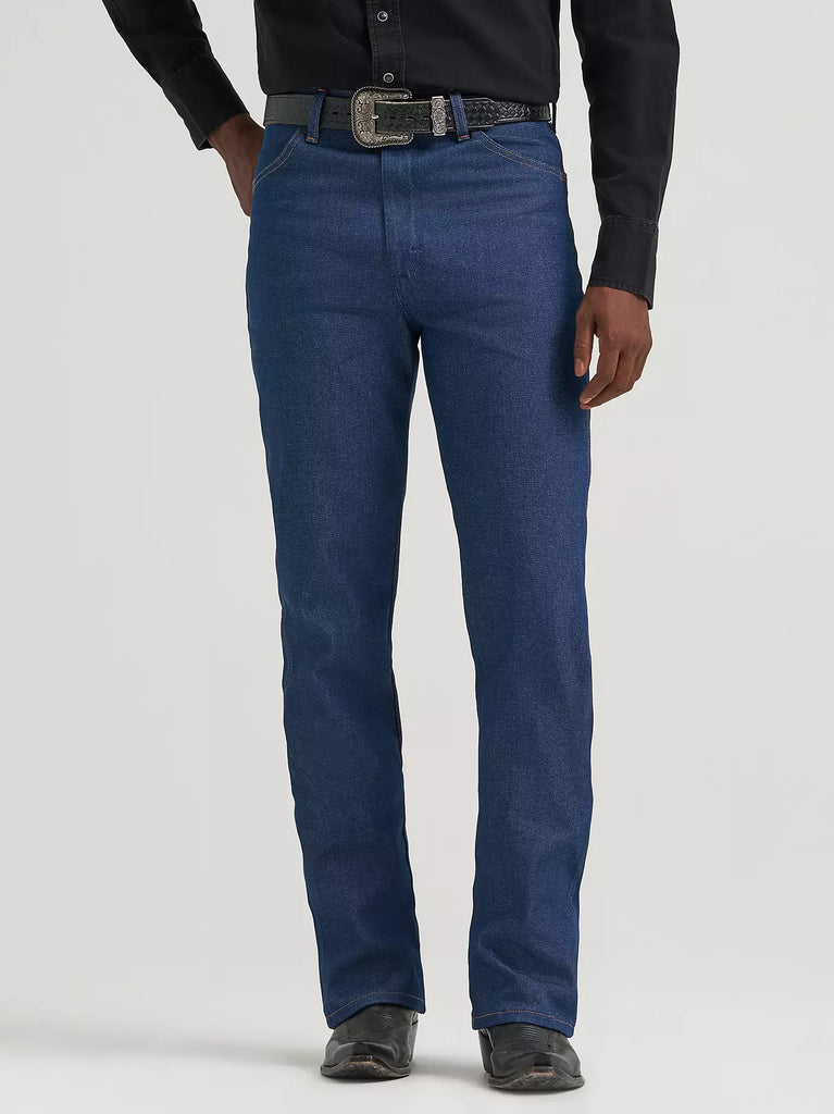 Men’s Wrangler Boot Cut Slim Jeans in Navy, slim fit through seat and thigh for a modern look, with boot cut leg opening designed to fit over boots - 935NAV. Available at Blair's Western Wear, Marble Falls, TX.