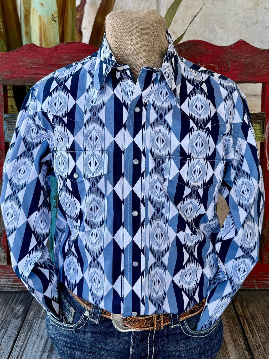Men’s Wrangler long sleeve snap Aztec print shirt in white, navy, and light blue, lightweight woven fabric for breathable comfort, with pearl snap closures and snap chest pockets – 112374917. Available at Blair's Western Wear, Marble Falls, TX.