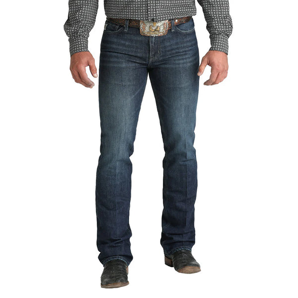 The Cinch Ian Slim Fit Jean features a mid-rise and a slim fit through the seat, thigh, and knee for a clean, modern look. Made with comfortable stretch denim and finished in a medium-dark stonewash, it offers classic five-pocket styling and a boot-friendly leg opening perfect for everyday wear. Men's Ian Slim Fit Jean - MB32036001 - BLAIR'S Western Wear 