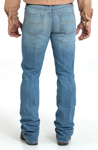 The Cinch Ian Slim Fit Jean offers a sleek, comfortable look with its mid-rise and slim fit through the seat, thigh, and knee. Made with stretch denim for easy movement and finished in a medium stonewash with subtle sanding, it pairs a modern style with classic five-pocket details and a boot-friendly leg opening. Men's Ian Slim Fit Jean - MB31836001. Available at BLAIR'S Western Wear located in Marble Falls TX.
