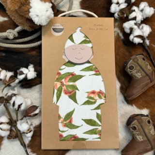 Milkbarn Newborn Gown & Hat Set that is white with a peach pattern; the material it is made of organic cotton- 71119 - Available at BLAIR'S Western Wear located in Marble Falls TX
