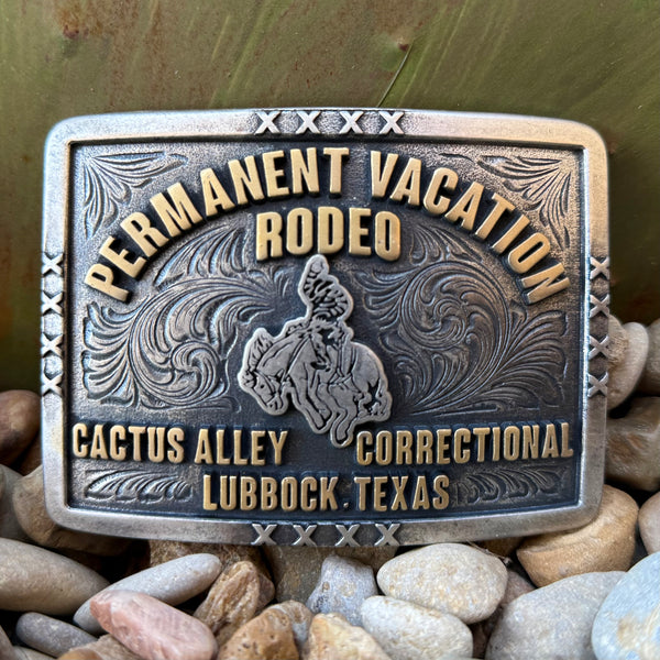 Montana Silversmiths Attitude rodeo belt buckle in silver and gold, detailed bucking horse and rider figure at center, with engraved bright-cut scrollwork background - A1085CA. Available at Blair's Western Wear, Marble Falls, TX.