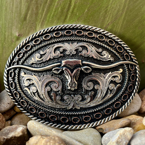 Montana Silversmiths Belt Buckle in silver and copper, featuring a longhorn steer and barbed wire detailing - A742. Available at Blair's Western Wear, Marble Falls, TX.