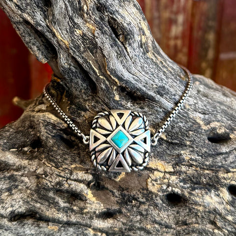 Montana Silversmiths turquoise Desert Sage bracelet with square turquoise center stone, antiqued silver-tone floral and geometric detailing, and adjustable chain closure - BC6116. Available at Blair's Western Wear, Marble Falls, TX.