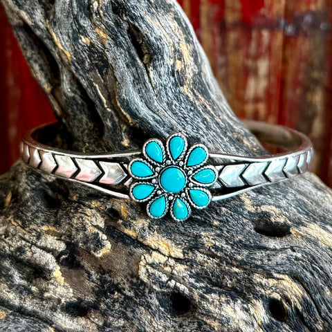 Montana Silversmiths cuff bracelet with turquoise flower in silver, featuring a chevron-etched band and adjustable open-back design – BC5380. Available at Blair's Western Wear, Marble Falls, TX.