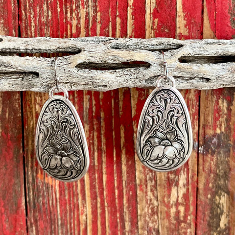 Montana Silversmiths Earring Teardrop in silver, featuring detailed floral engravings and hypoallergenic stainless steel French wires - ER5670. Available at Blair's Western Wear, Marble Falls, TX.