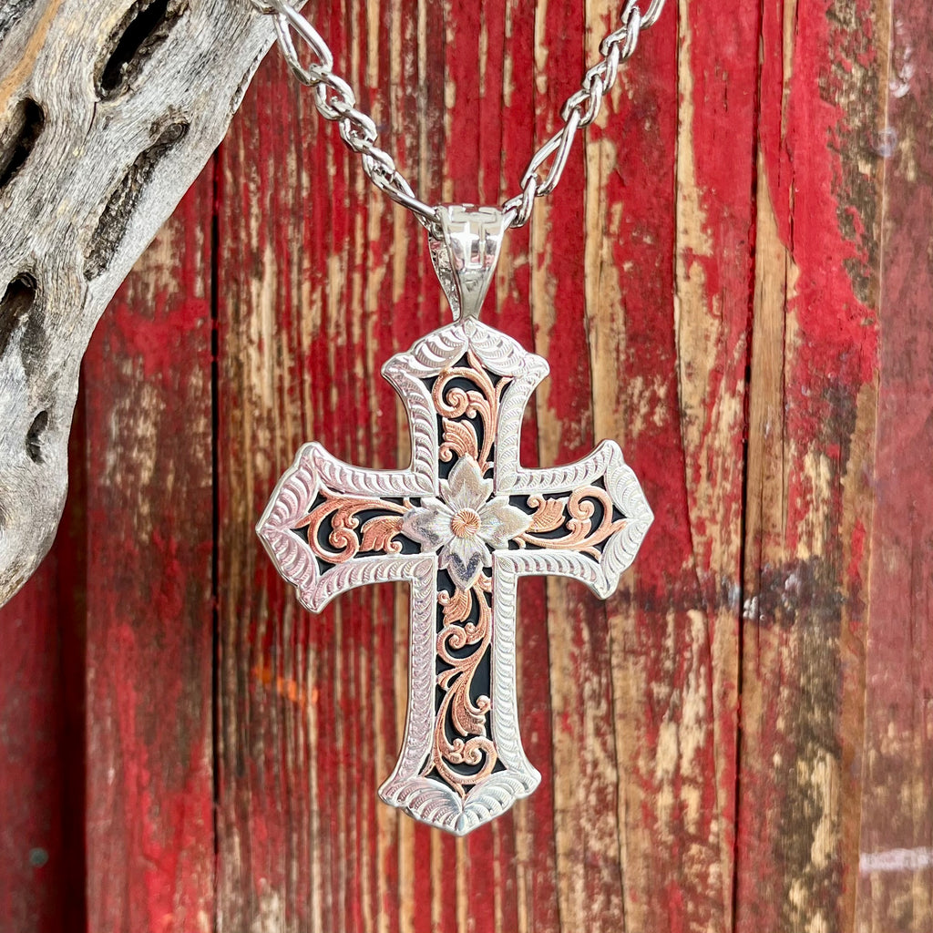 Montana Silversmiths Necklace Cross in silver and rose gold, featuring intricate filigree design and floral accents on a 22-inch chain - NC1019RGRTS. Available at Blair's Western Wear, Marble Falls, TX.