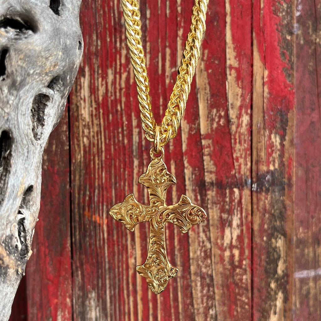 Montana Silversmiths Necklace featuring a gold Harvest Moon Cross, elegantly designed with intricate detailing and durable gold plating over a brass base, protected by Montana Armor for long-lasting shine. Pendant measures 1.25 inches by 2.25 inches, on a 24-inch chain - NC2105G. Available at Blair's Western Wear, Marble Falls, TX.
