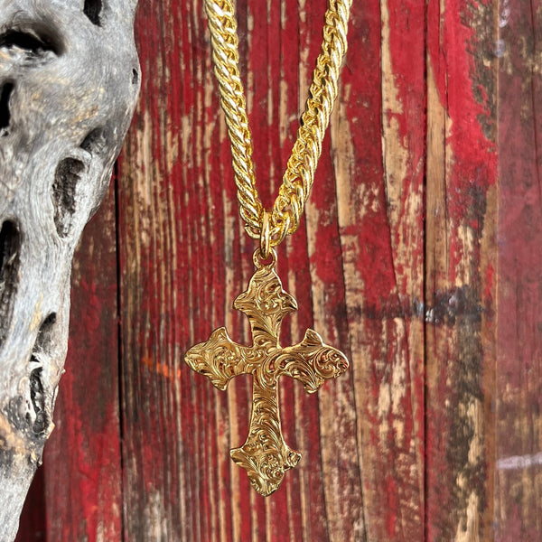 Montana Silversmiths Necklace featuring a gold Harvest Moon Cross, elegantly designed with intricate detailing and durable gold plating over a brass base, protected by Montana Armor for long-lasting shine. Pendant measures 1.25 inches by 2.25 inches, on a 24-inch chain - NC2105G. Available at Blair's Western Wear, Marble Falls, TX.