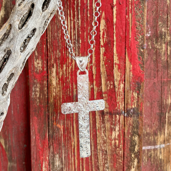 Montana Silversmiths Necklace Large Silver Cross in silver, elegantly detailed with bright cut engraving and a small flower accent - NC5890. Available at Blair's Western Wear, Marble Falls, TX.