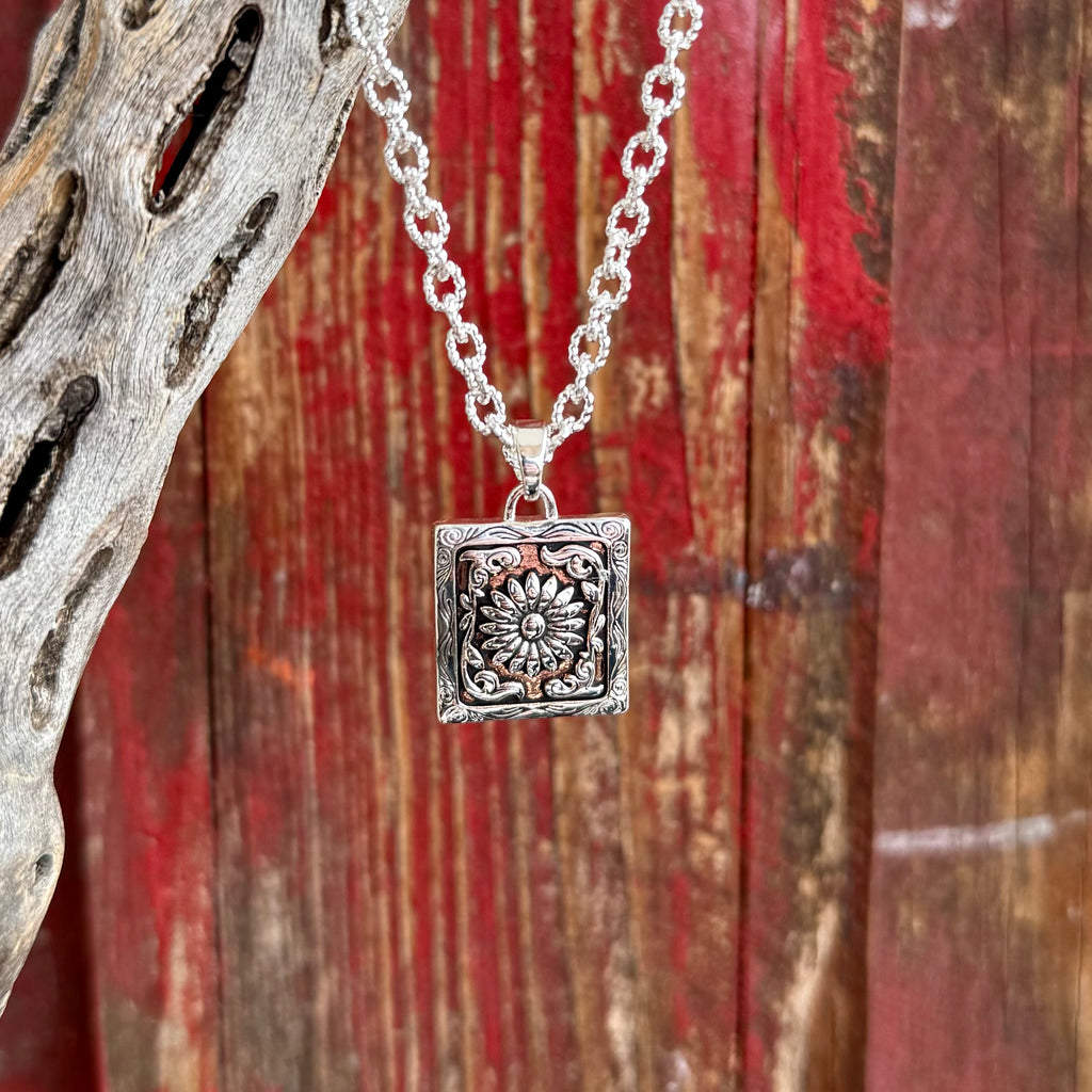 Montana Silversmiths necklace silver Ranch House pendant in silver, intricately engraved square pendant with raised floral center, with antiqued silver-tone finish and detailed corner accents - NC6464. Available at Blair's Western Wear, Marble Falls, TX.