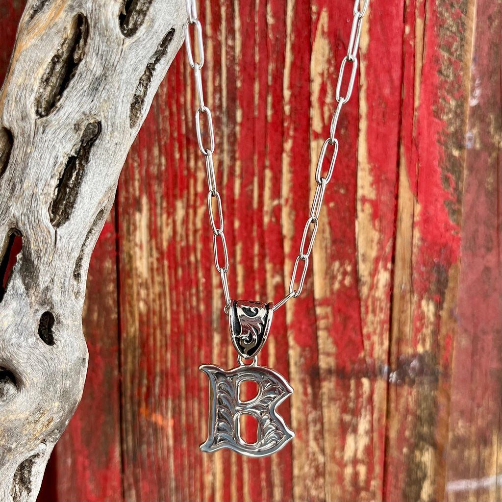Montana Silversmiths Silver Scroll Necklace featuring an intricately engraved letter "B" pendant, durable rhodium plating, adjustable 18-inch chain, and Montana Armor coating - NC6096B. Available at Blair's Western Wear, Marble Falls, TX.