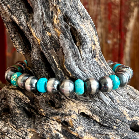 Nizhoni Traders bracelet pearl beaded stretch bracelet in turquoise, handcrafted sterling silver pearl beads provide a polished Western look, with genuine turquoise accent stones adding natural color and unique matrix - NZBRPEARLTQ. Available at Blair's Western Wear, Marble Falls, TX.