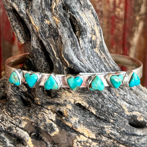 Nizhoni Traders cuff bracelet turquoise heart sterling silver bracelet in turquoise, genuine Kingman turquoise heart stones set on a handcrafted sterling silver cuff - NZBRCUFHRT. Available at Blair's Western Wear, Marble Falls, TX.