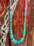 Nizhoni Traders necklace disk beaded necklace in turquoise and brown, crafted with genuine turquoise disk beads that provide natural variation in color, with sterling silver round and heishi-style beads for durability - NKDISKFAB. Available at Blair's Western Wear, Marble Falls, TX.