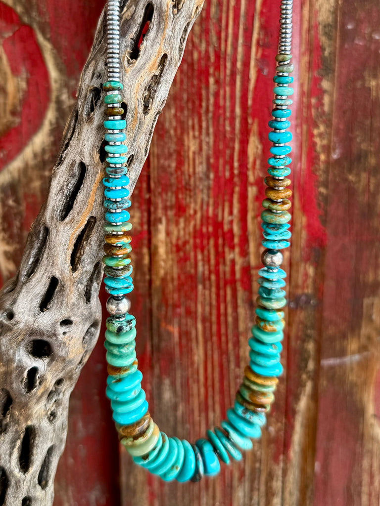 Nizhoni Traders necklace disk beaded necklace in turquoise and brown, crafted with genuine turquoise disk beads that provide natural variation in color, with sterling silver round and heishi-style beads for durability - NKDISKFAB. Available at Blair's Western Wear, Marble Falls, TX.