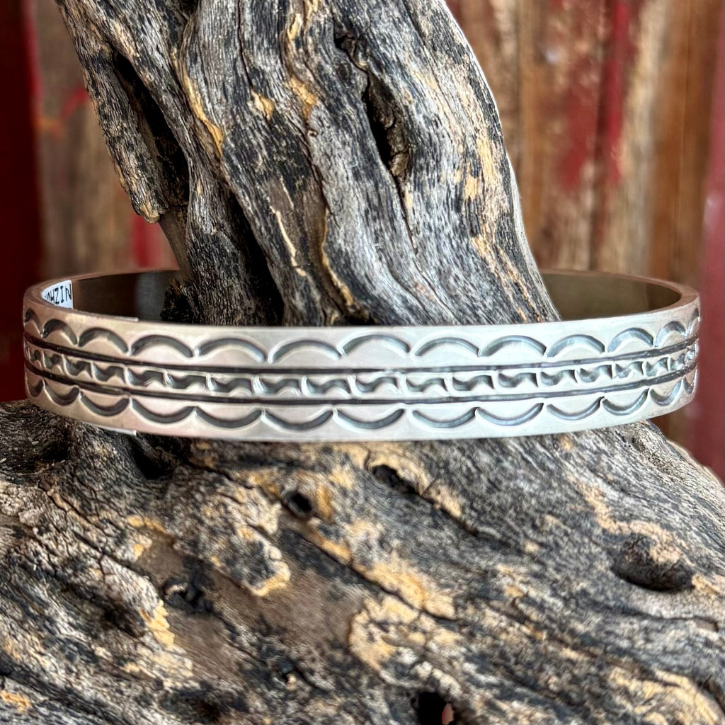 Nizhoni Traders sterling silver engraved cuff bracelet in silver, hand-stamped Navajo-inspired pattern for authentic Western style, with adjustable open cuff design for comfortable everyday wear - NZCUFFENR. Available at Blair's Western Wear, Marble Falls, TX.
