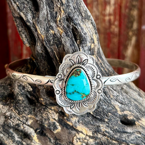 Nizhoni Traders sterling silver cuff bracelet with Sonoran Mountain turquoise, handcrafted sterling silver cuff offers durable everyday wear, with traditional concho-style hand-stamped detailing - NZBRCONCH. Available at Blair's Western Wear, Marble Falls, TX.